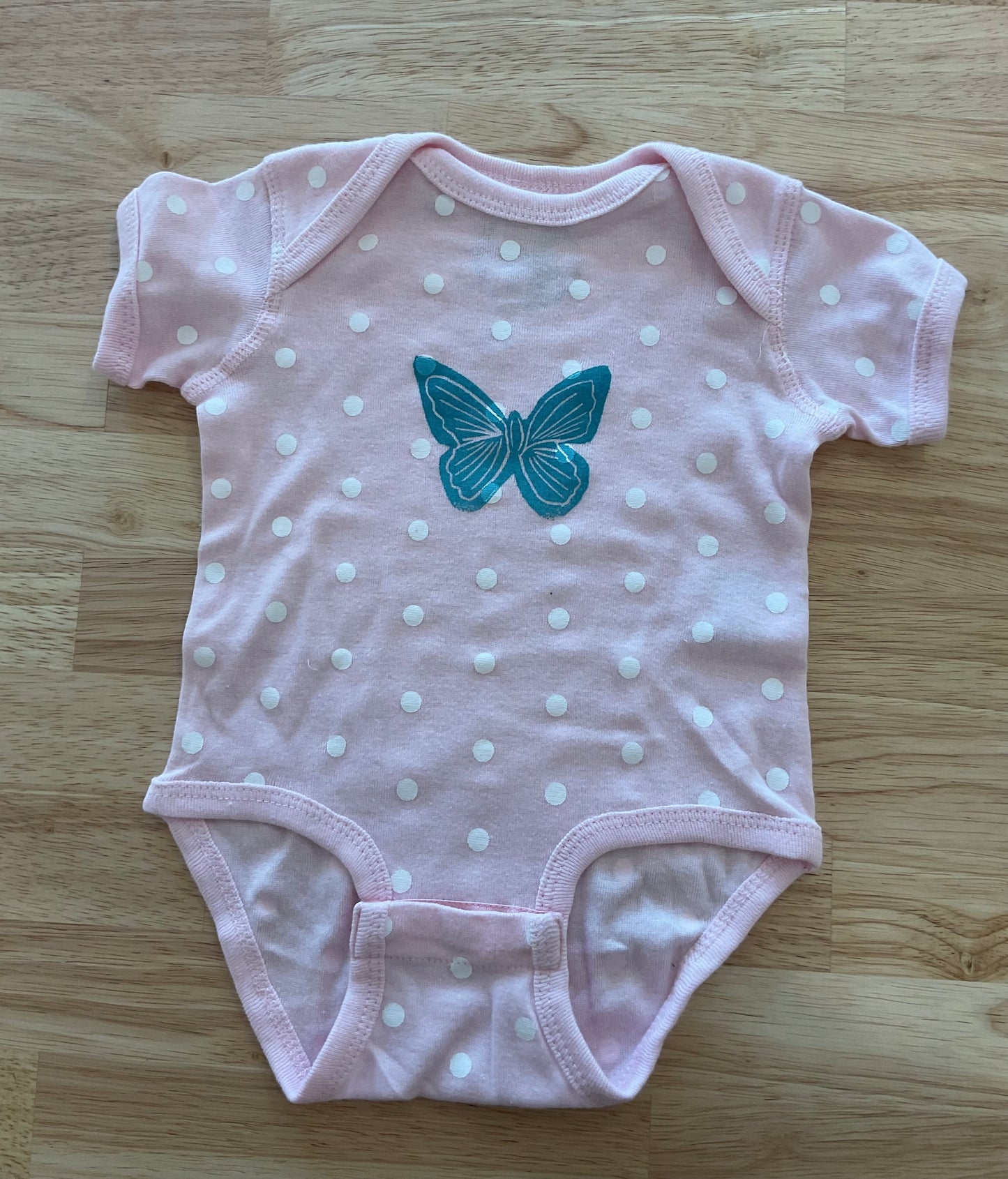 Pink polka dot butterfly onesie