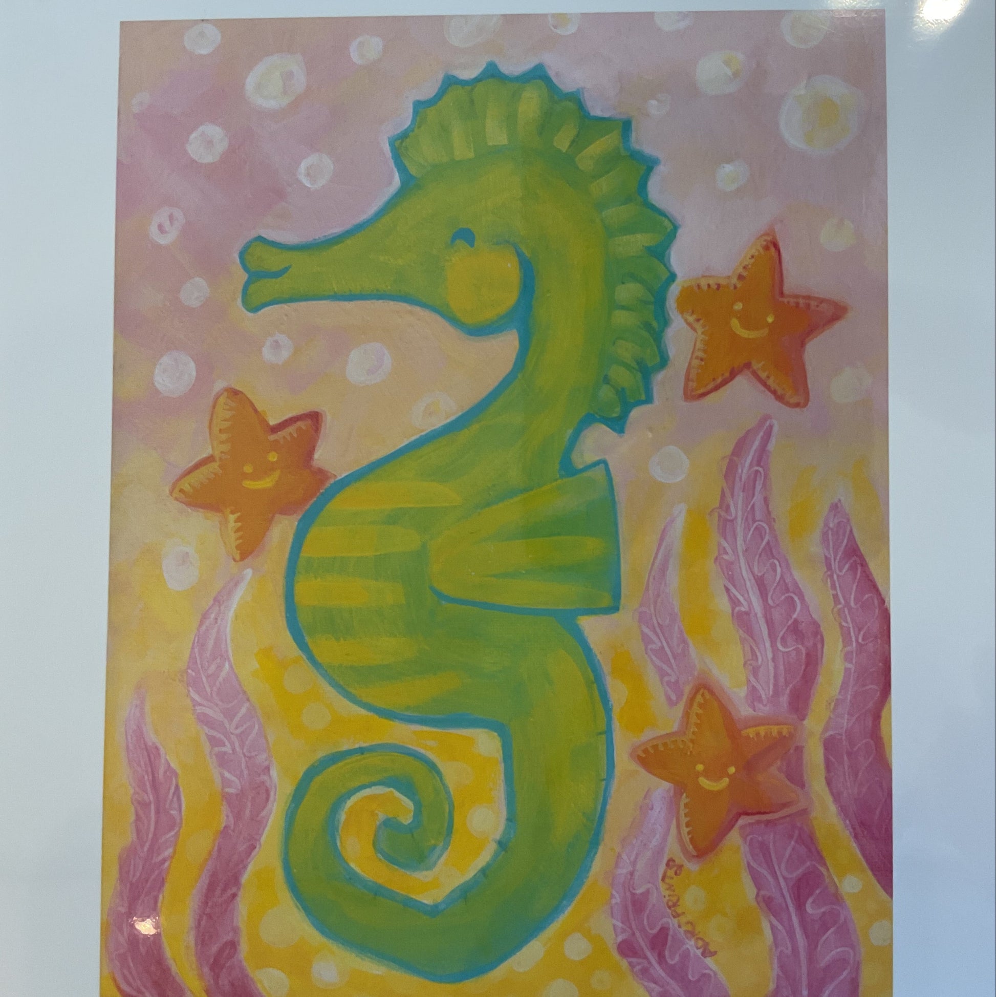 Colorful artwork of a green elephant with stars and wavy lines on a patterned background