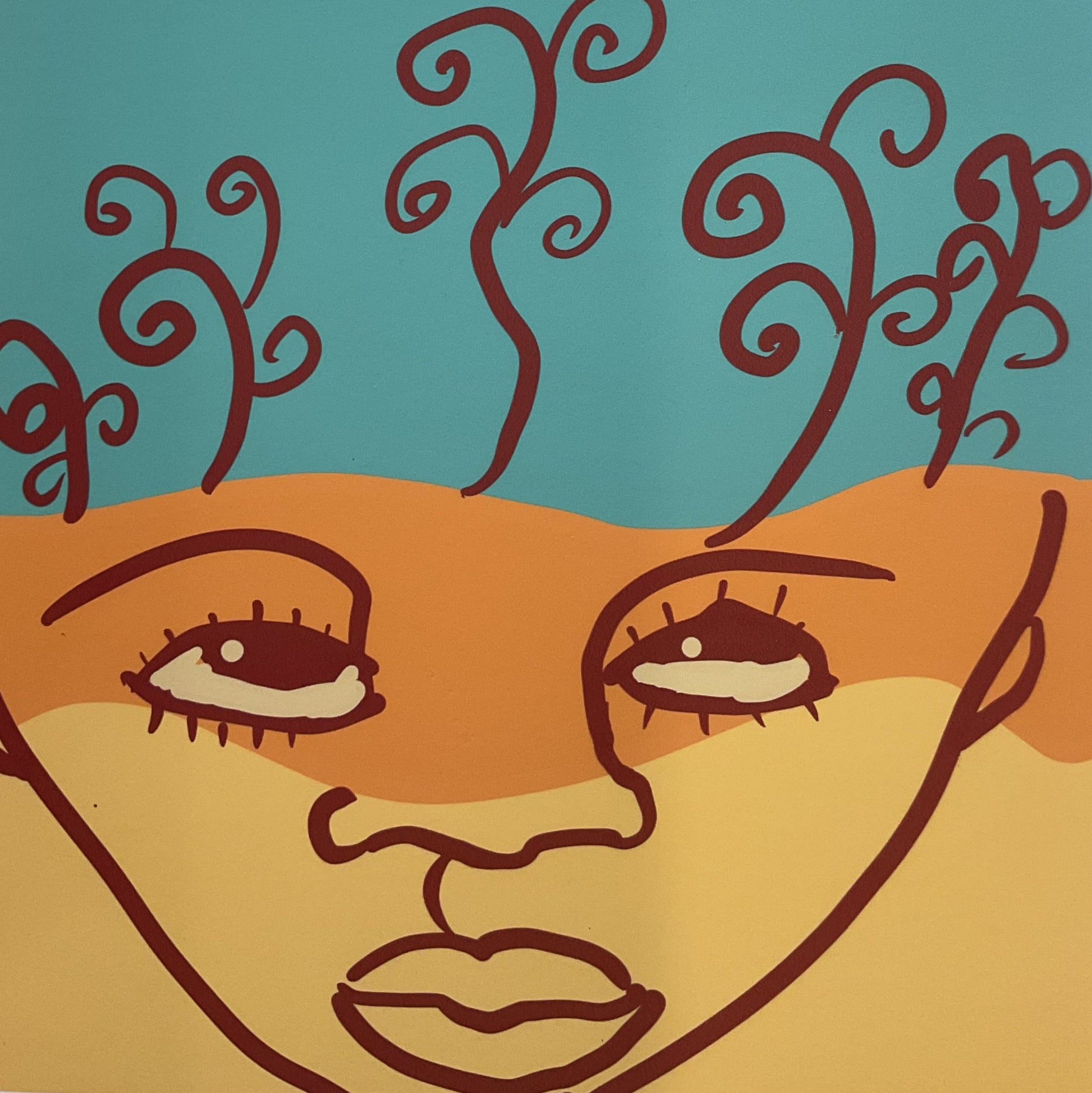 Abstract artwork with stylized face and swirling lines on a wooden surface