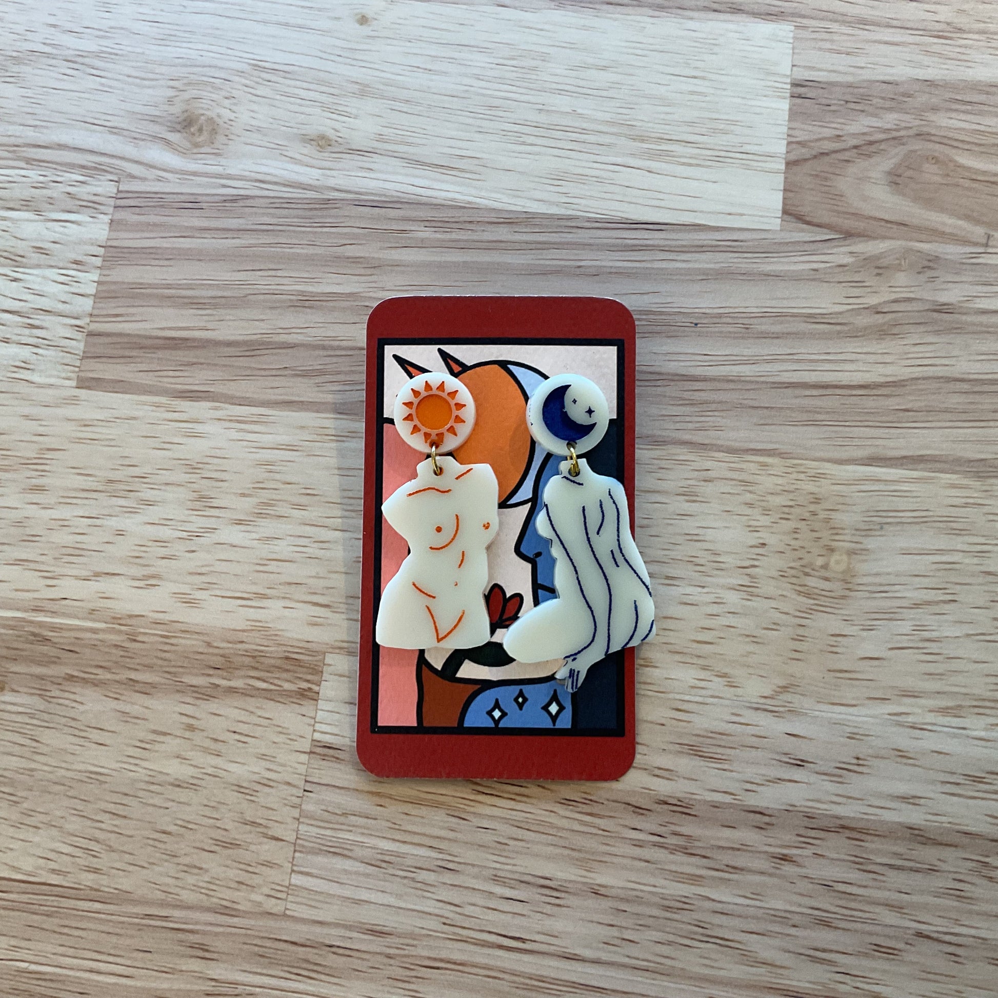 Decorative card with abstract design on a wooden surface