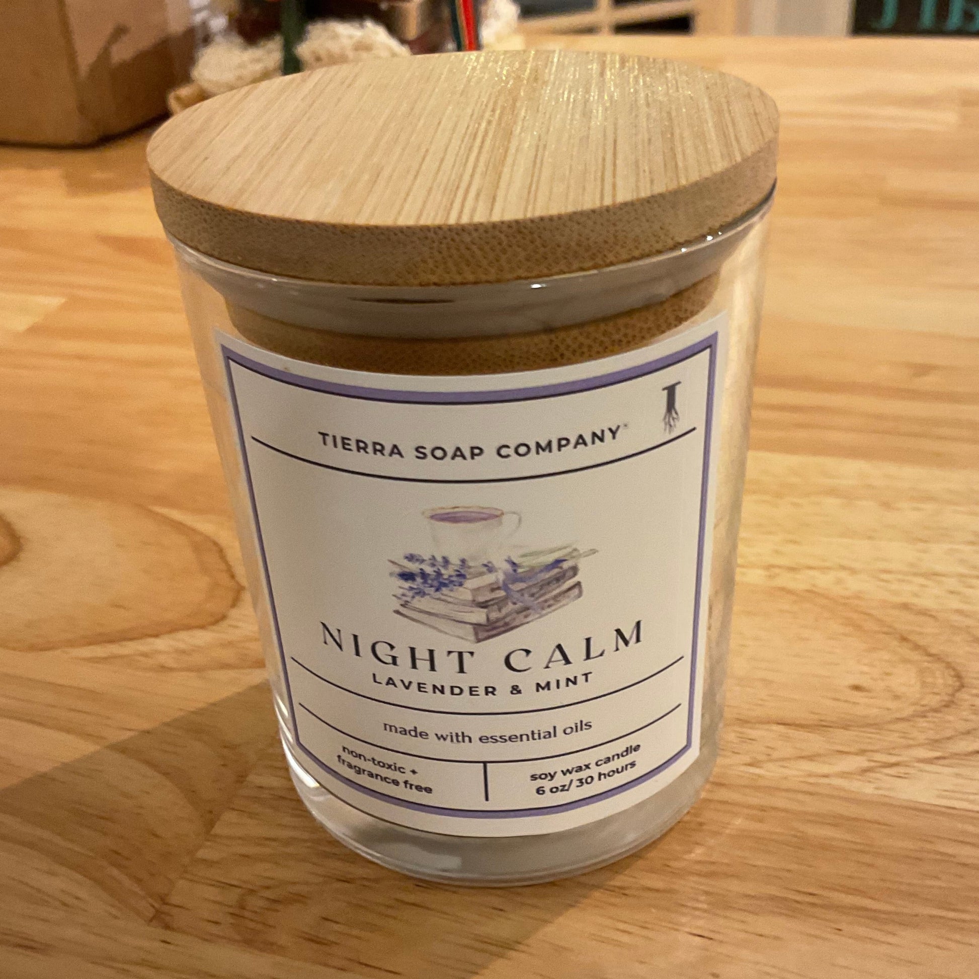 Container labeled 'Night Calm' on a wooden surface
