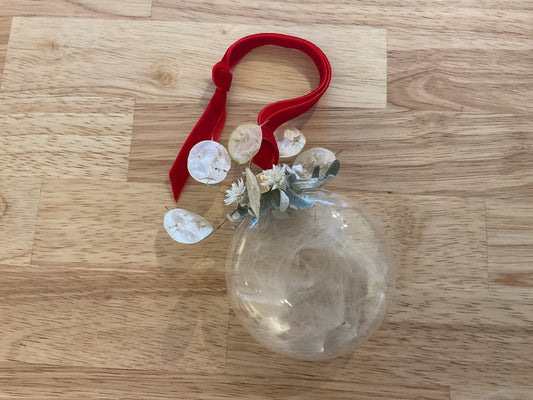 Glass ornament with milkweed