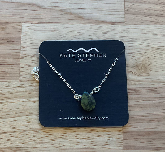 Serpentine droplet on silver