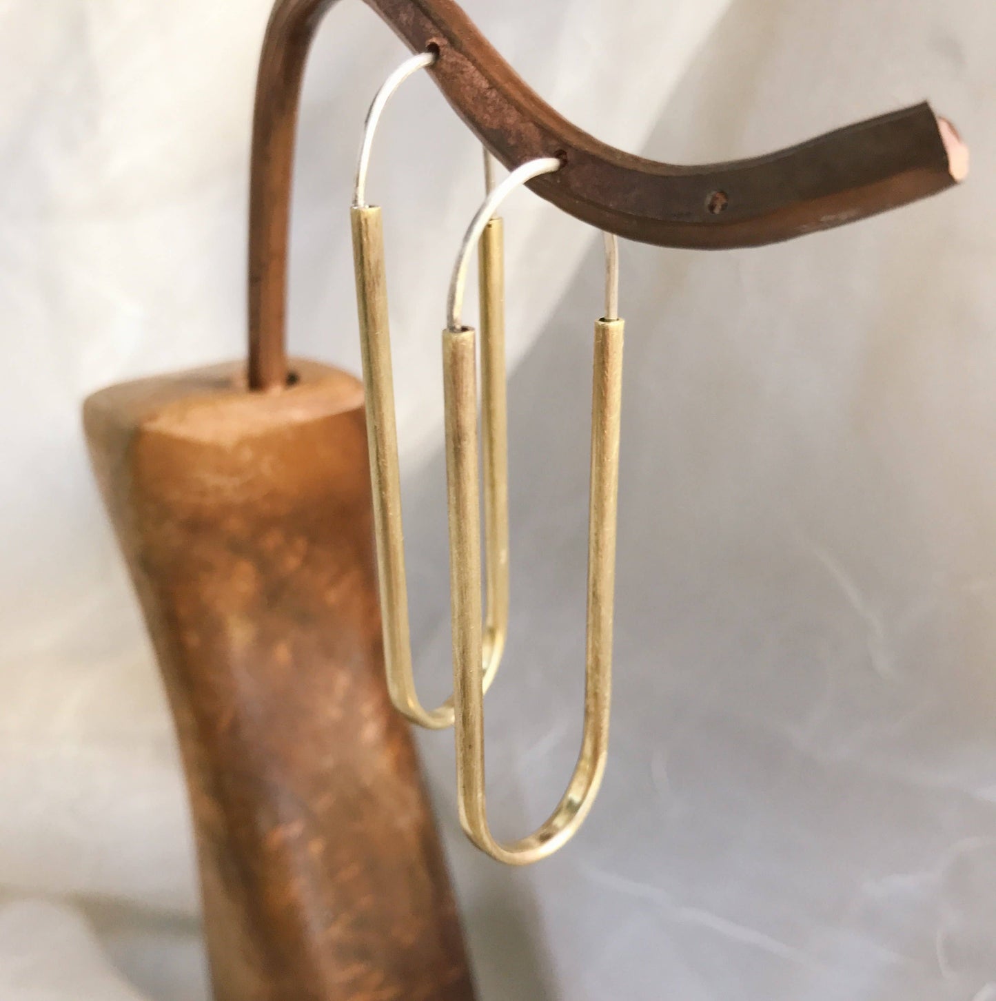 Hand-formed brass and sterling hoops