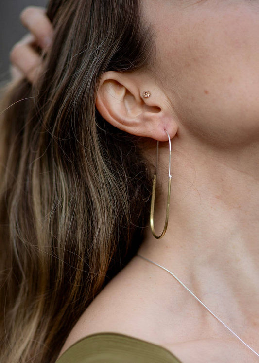 Hand-formed brass and sterling hoops