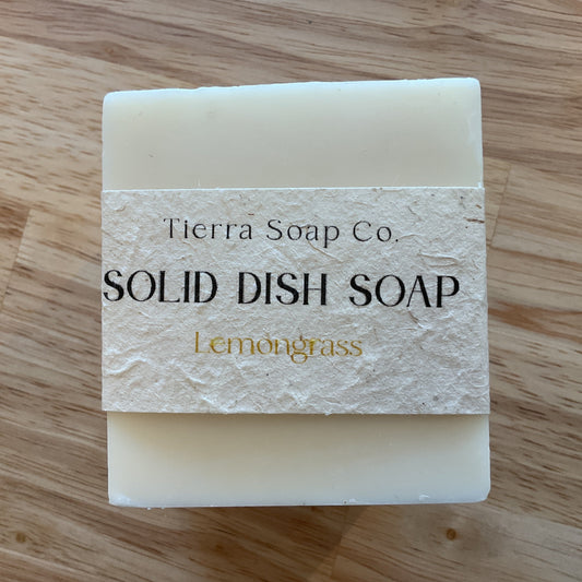 Solid dish soap bar from Tierra Soap Co. on a wooden surface